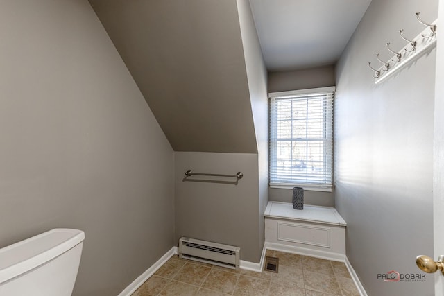 half bath featuring baseboards, visible vents, tile patterned flooring, a baseboard heating unit, and toilet