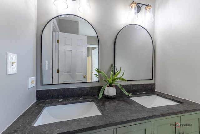 bathroom featuring double vanity and a sink