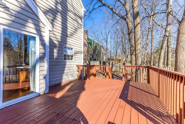 wooden deck featuring fence