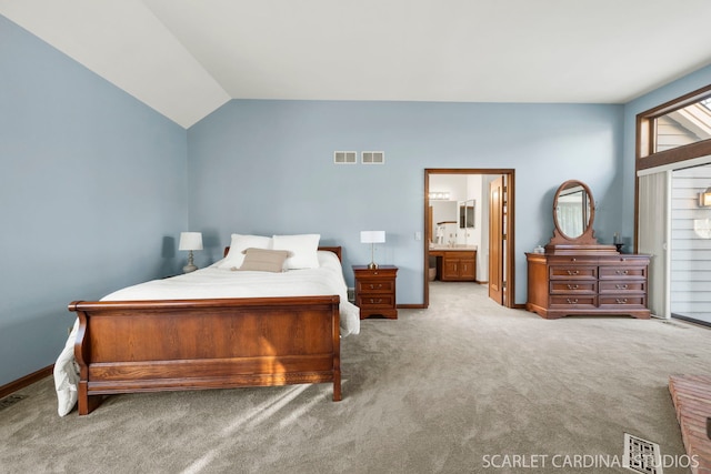 bedroom featuring vaulted ceiling and light colored carpet