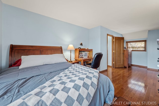 bedroom with hardwood / wood-style flooring