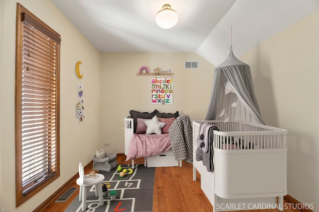 bedroom with wood-type flooring