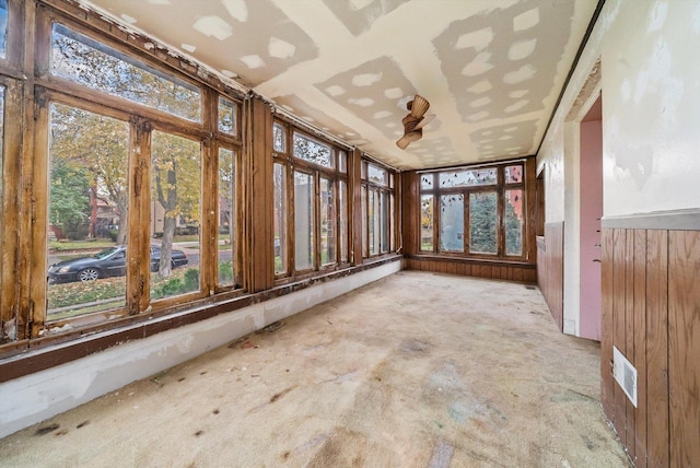 unfurnished sunroom with a wealth of natural light