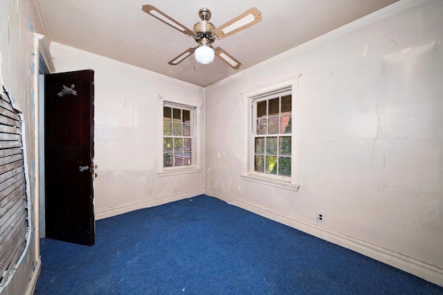 carpeted empty room featuring ceiling fan