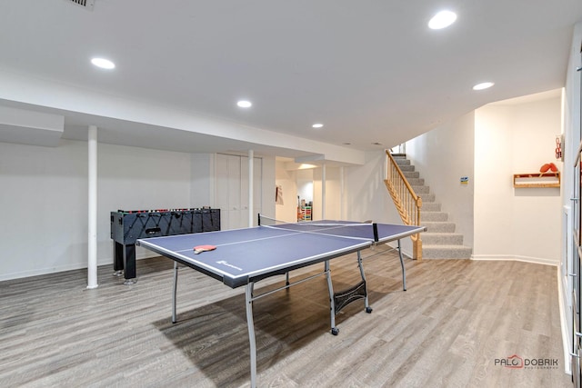 recreation room with light hardwood / wood-style floors