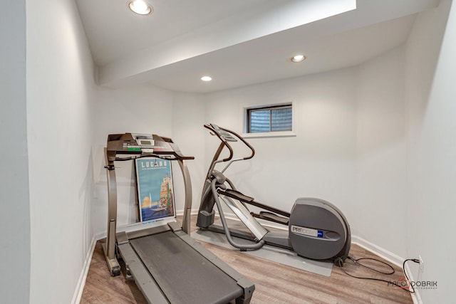 exercise room featuring hardwood / wood-style flooring