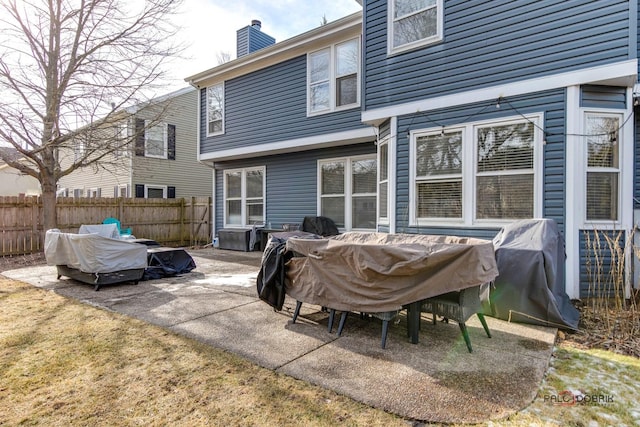 rear view of property featuring a patio area