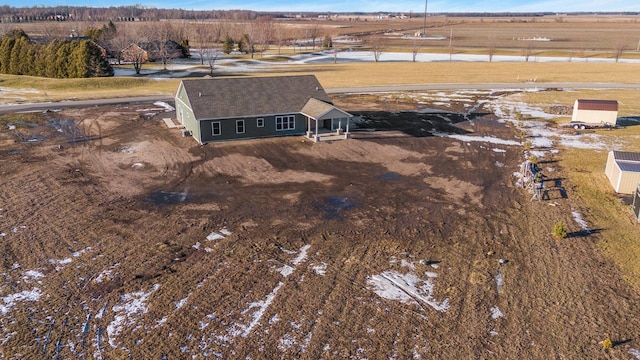 birds eye view of property featuring a rural view