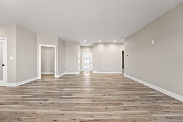 unfurnished living room with light wood-type flooring