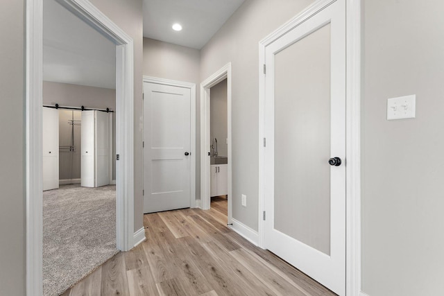 hallway featuring light hardwood / wood-style flooring