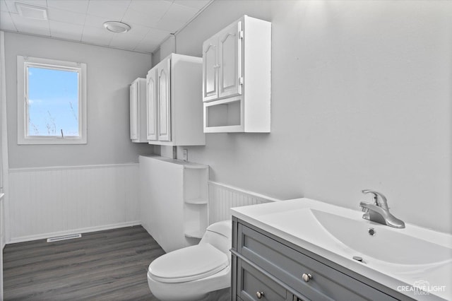 bathroom featuring hardwood / wood-style floors, toilet, and vanity