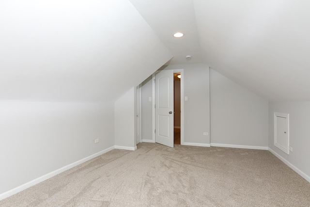 bonus room featuring light carpet and lofted ceiling