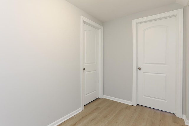 corridor featuring light hardwood / wood-style floors