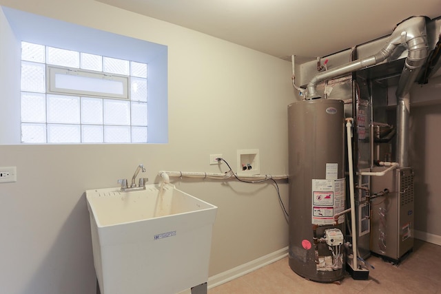 utilities with sink and gas water heater