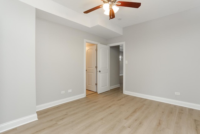 unfurnished bedroom featuring light wood-type flooring and ceiling fan