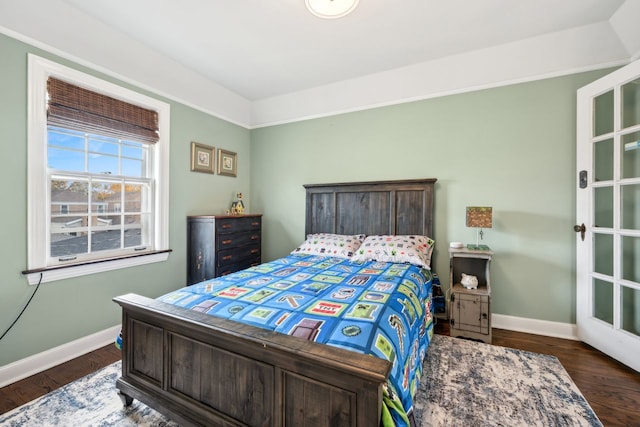 bedroom featuring dark hardwood / wood-style flooring