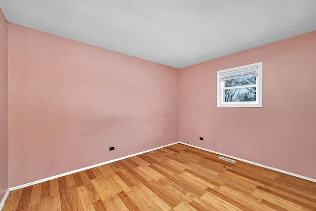 unfurnished room featuring light wood-type flooring