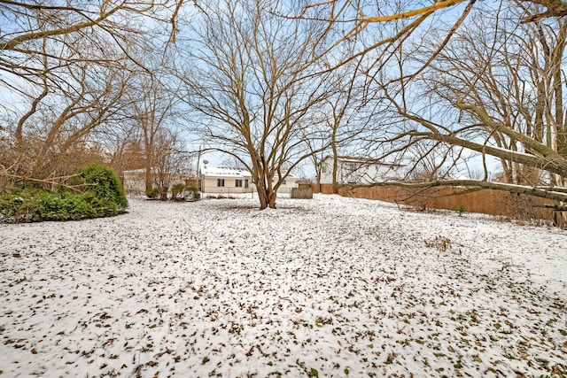 view of yard covered in snow