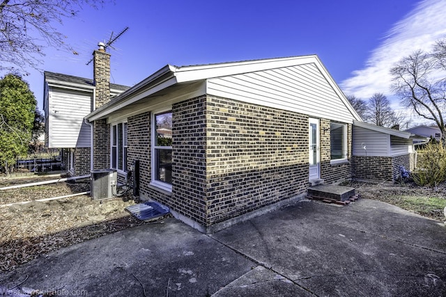 view of home's exterior featuring central AC and a patio area