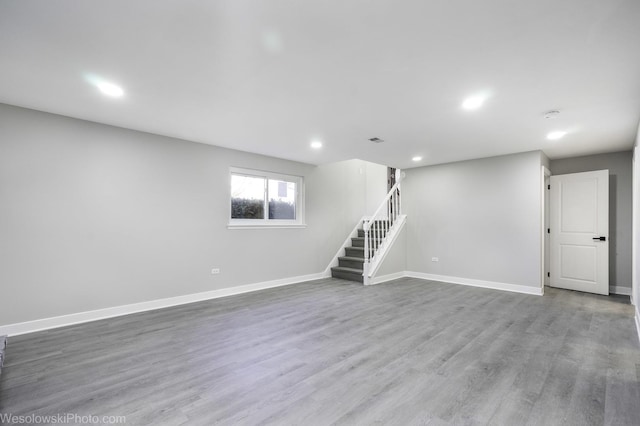 basement featuring hardwood / wood-style floors