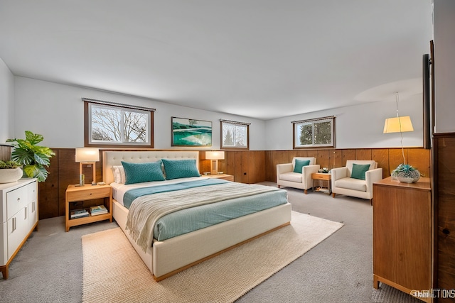 bedroom featuring light colored carpet