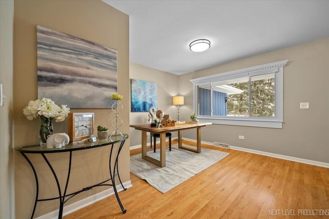 office space with hardwood / wood-style flooring