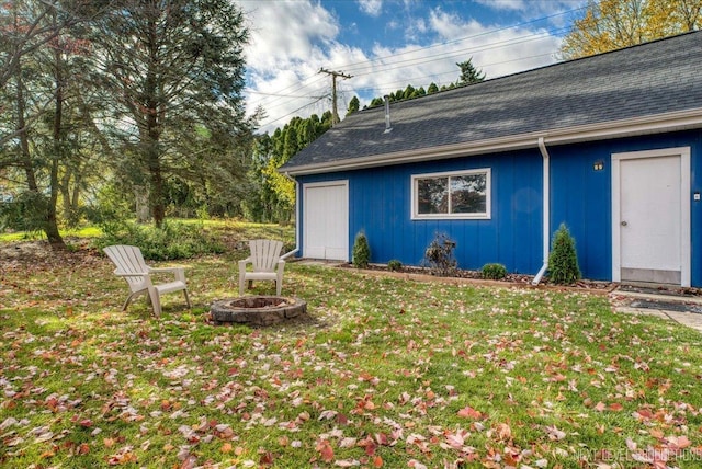 exterior space featuring an outdoor fire pit