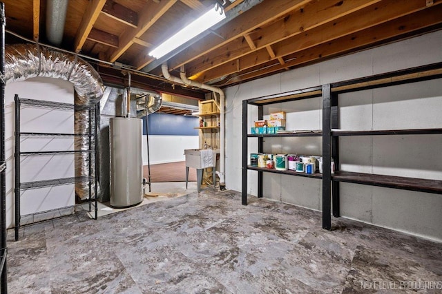 basement featuring sink and gas water heater