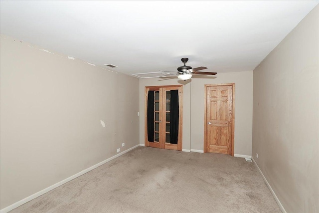 empty room with light carpet and ceiling fan