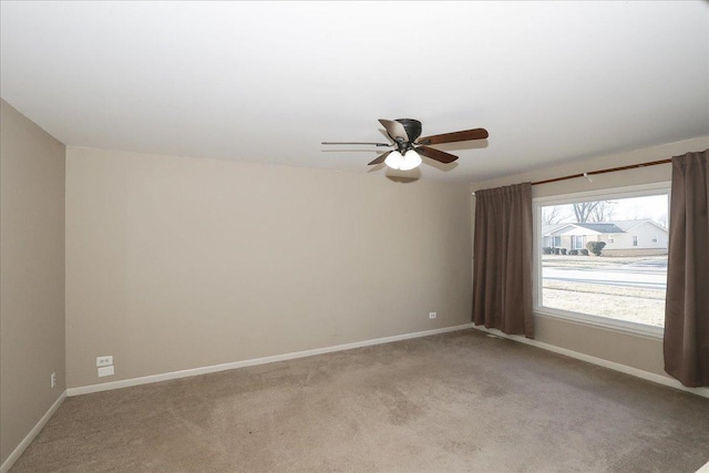 carpeted empty room with ceiling fan