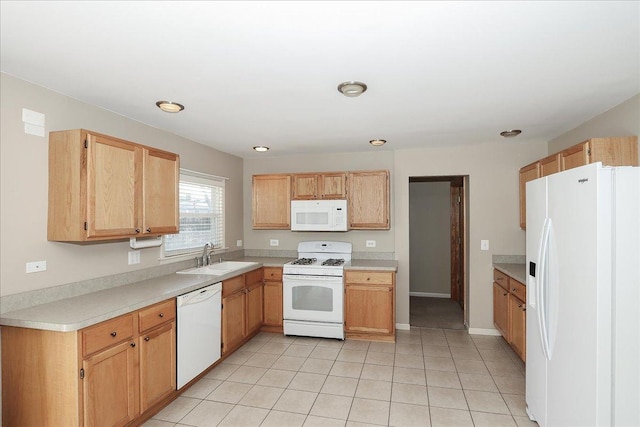 kitchen with sink, white appliances, and light tile patterned flooring