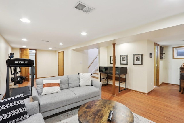 living room with light hardwood / wood-style flooring