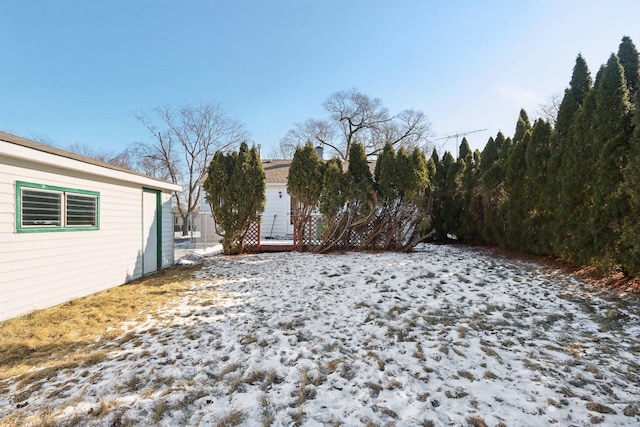 view of yard layered in snow