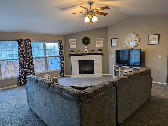 living room featuring ceiling fan, a brick fireplace, vaulted ceiling, and carpet