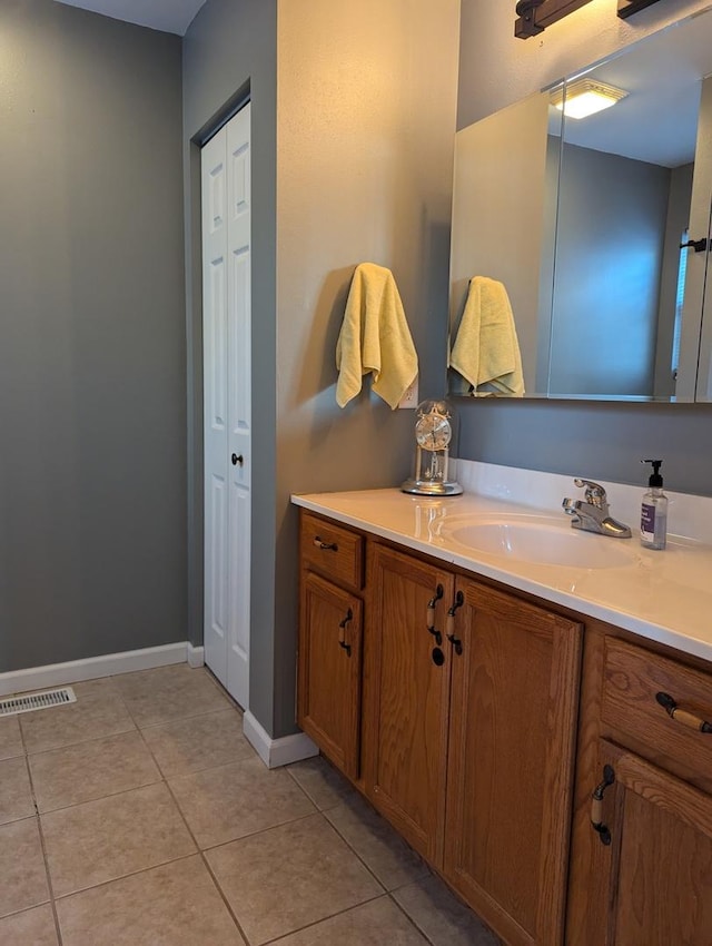 bathroom featuring tile patterned floors and vanity