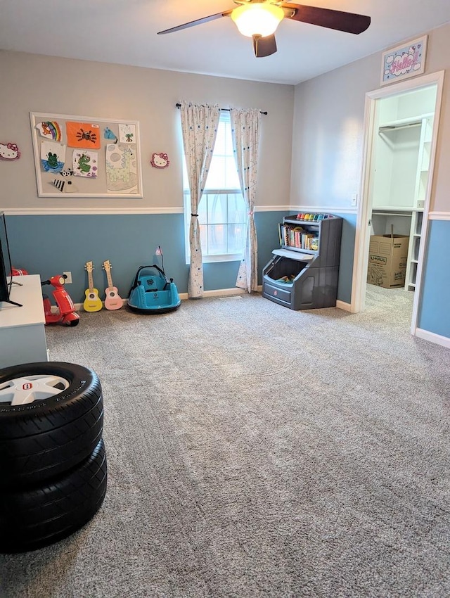 recreation room featuring carpet flooring and ceiling fan