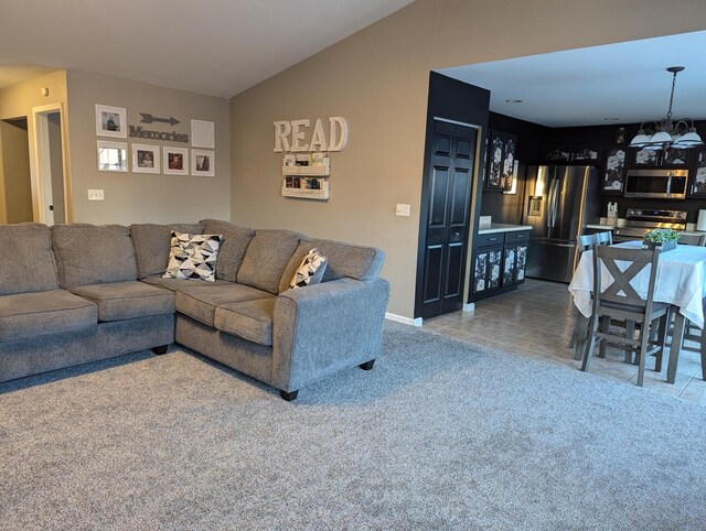 tiled living room with a chandelier and lofted ceiling