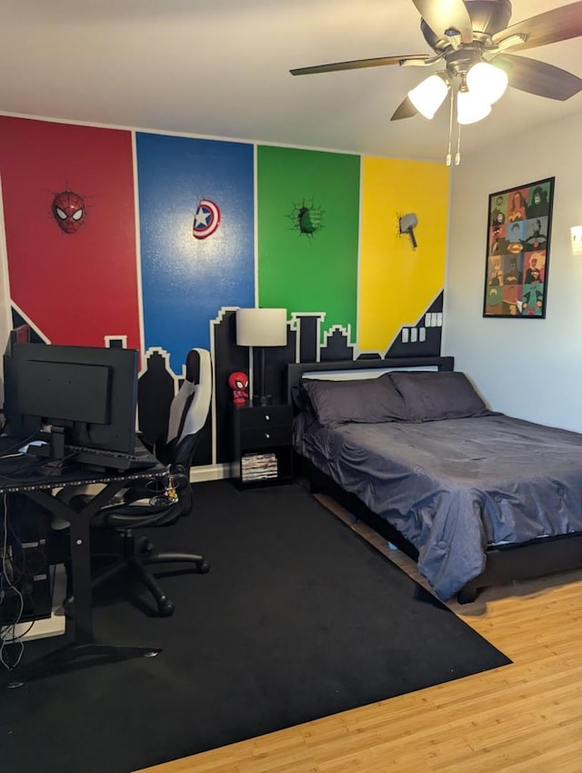 bedroom featuring ceiling fan and hardwood / wood-style flooring