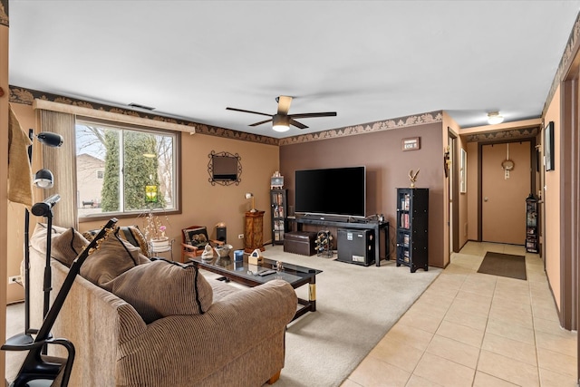 tiled living room with ceiling fan