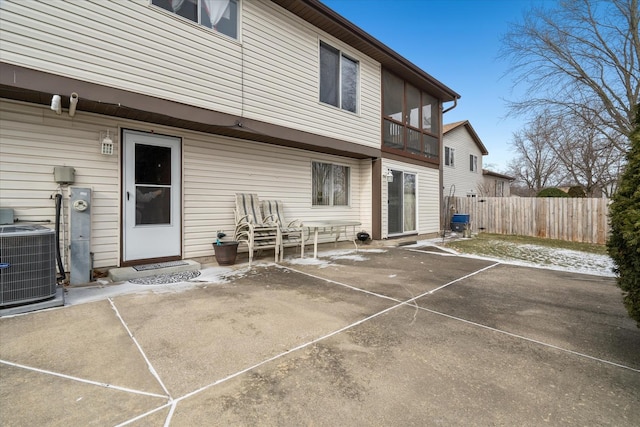 rear view of property with central AC and a patio area