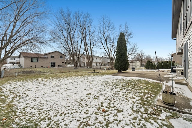 view of yard layered in snow