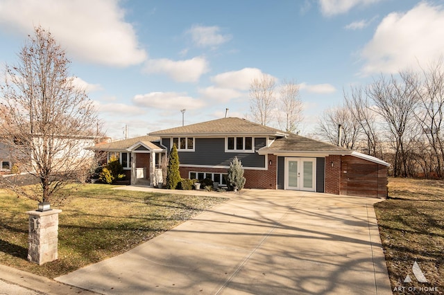 view of front of home with french doors and a front lawn