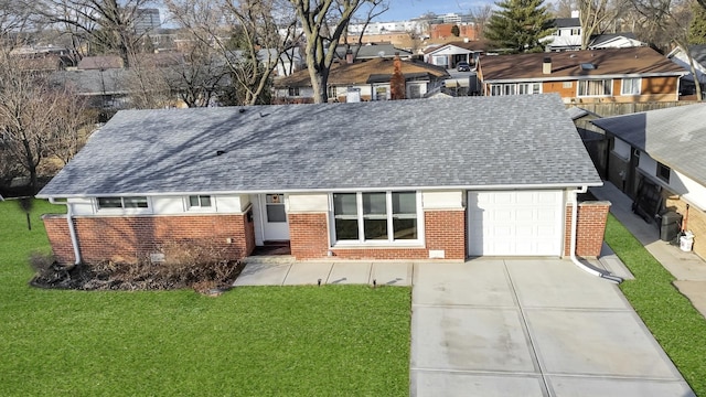 single story home with a garage and a front lawn