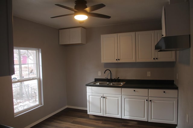 kitchen with plenty of natural light, sink, and white cabinets