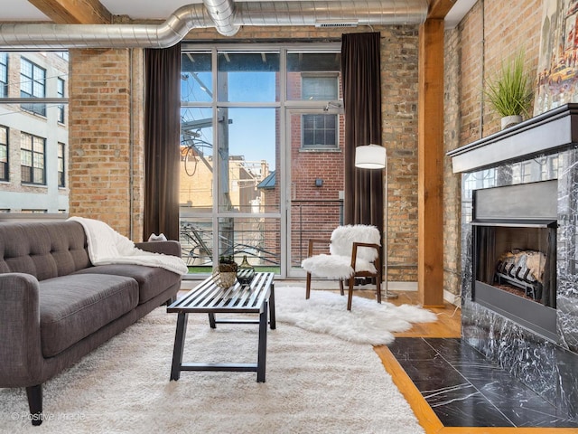 living room with brick wall