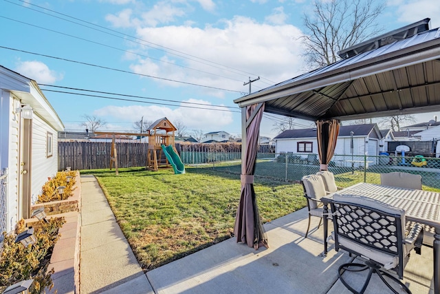 view of patio with a gazebo and a playground