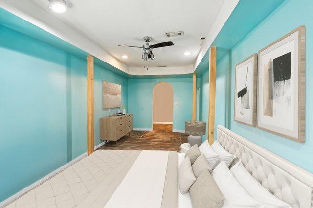 bedroom with ceiling fan and dark hardwood / wood-style floors