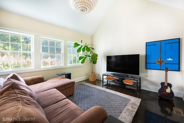 living room featuring dark hardwood / wood-style floors and high vaulted ceiling