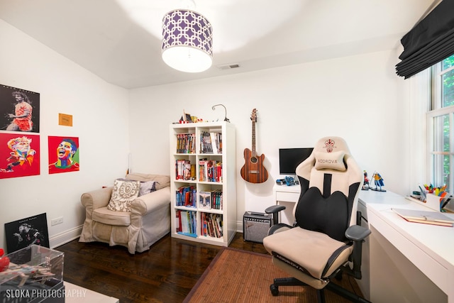 sitting room featuring dark wood-type flooring