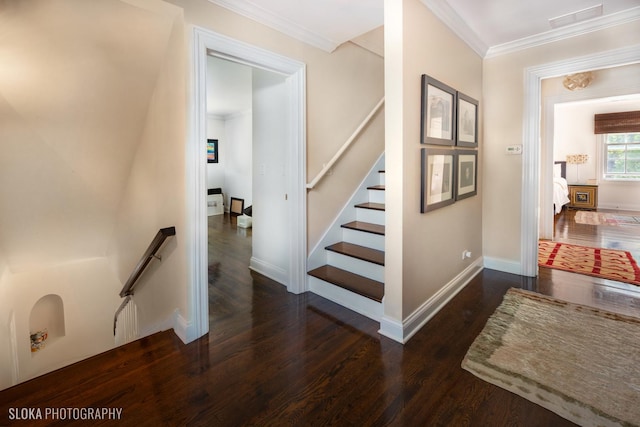 stairs featuring crown molding and hardwood / wood-style flooring